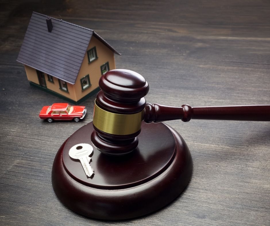 Landlord possession actions: House, car, house key and gavel